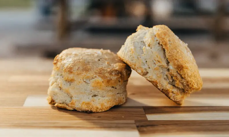 Buttermilk biscuits on the board in front of the Good Fruit camper