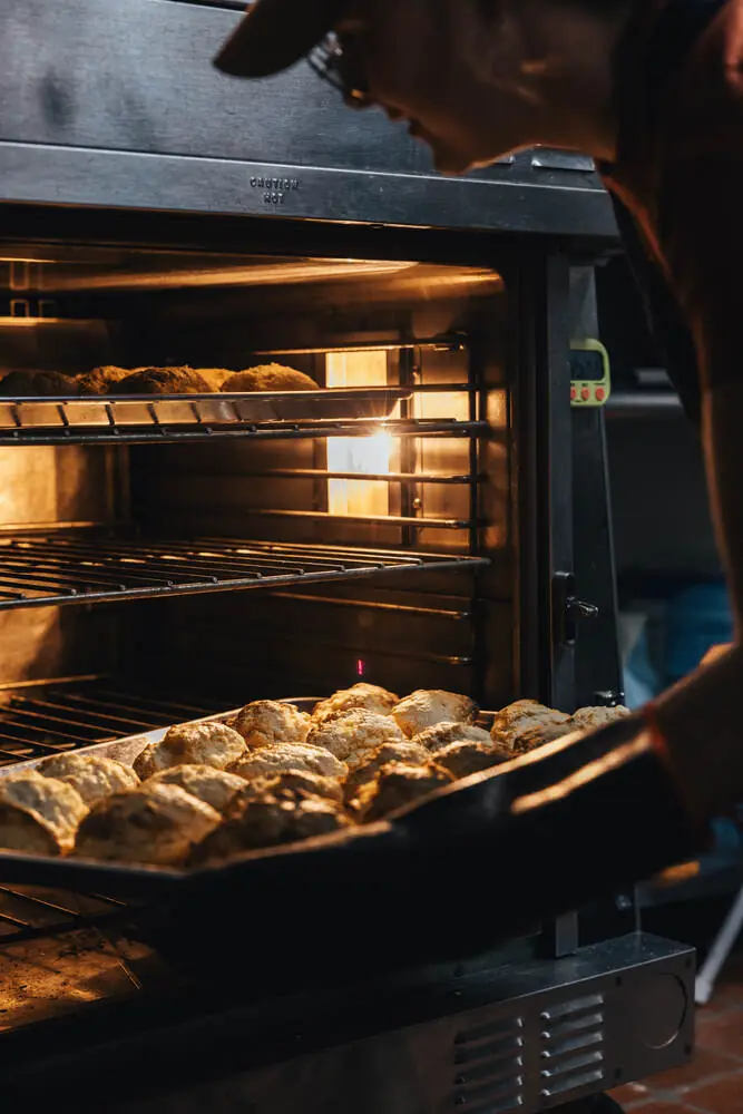 Tray of biscuits going into the oven before sunrise at Good Fruit